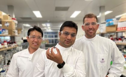 UQ researchers with a component of a newly developed rapid sensor. 